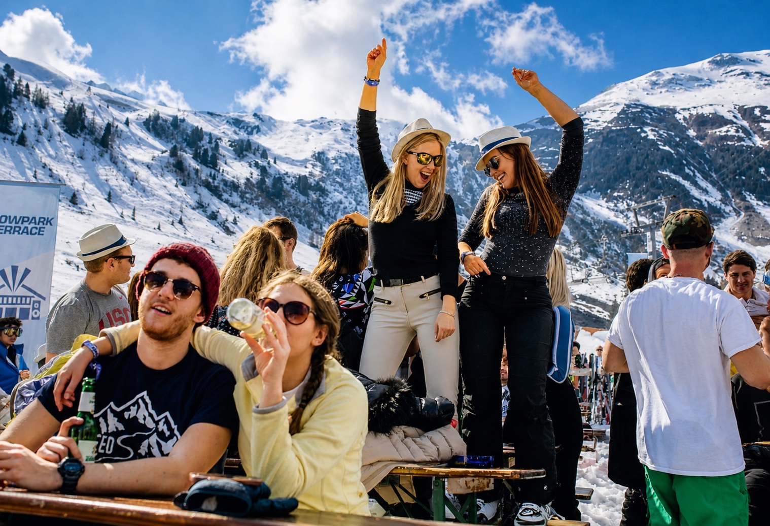 Guests celebrating at a snowy mountain terrace